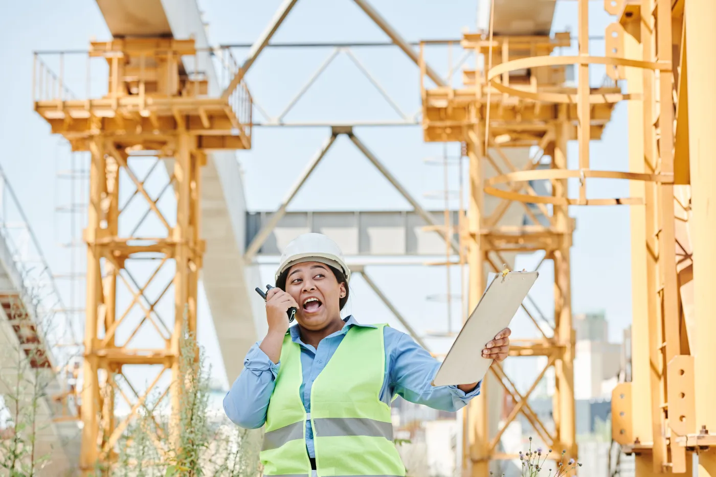 Field worker communicating with control room via two-way radio