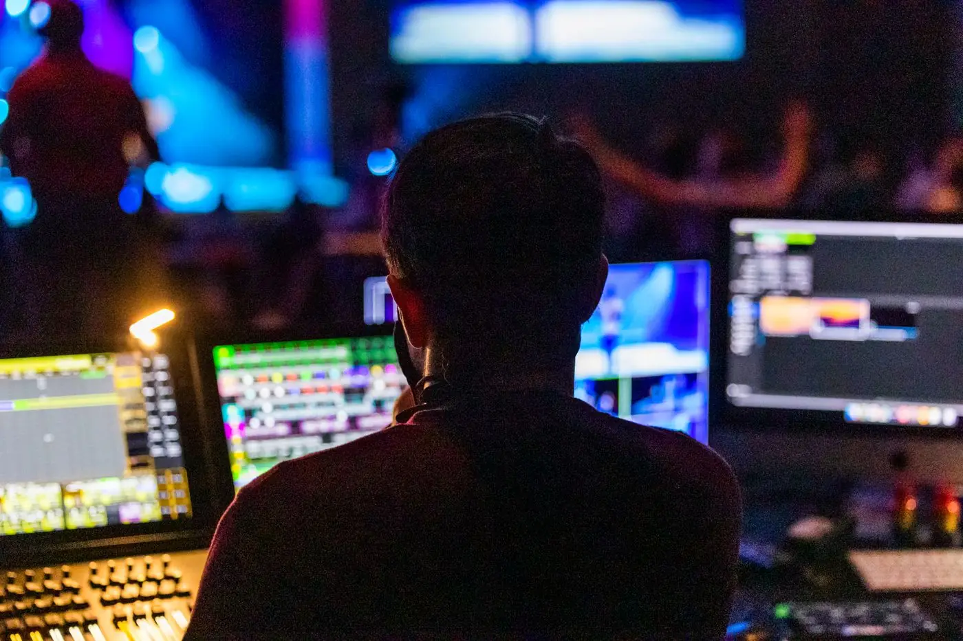 Event control room staff coordinating teams using their security radios