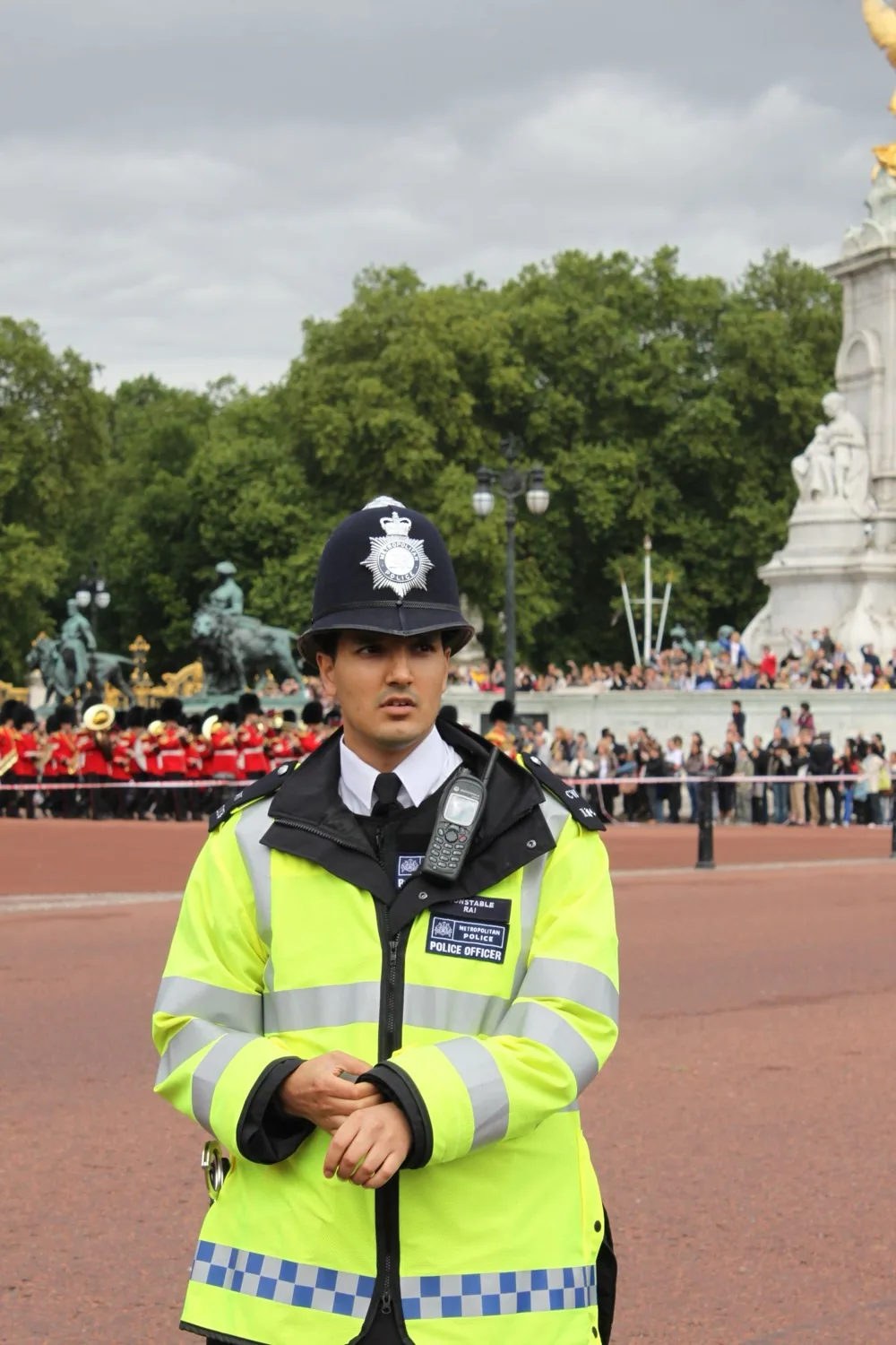UK Metropolitan Police constable on duty in London with a TETRA handheld radio mounted on his hi-vis jacket